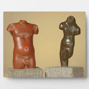 Red sandstone male torso and grey sandstone dancer plaque