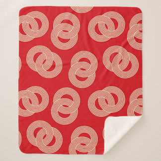 Red shades, interlocked striped rings pattern. sherpa blanket