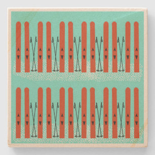 Red skis on blue coaster