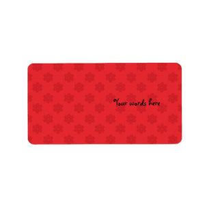 Red snowflake pattern on red label