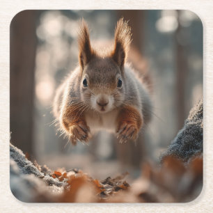 Red Squirrel Leaping in Frosty Forest Square Paper Coaster