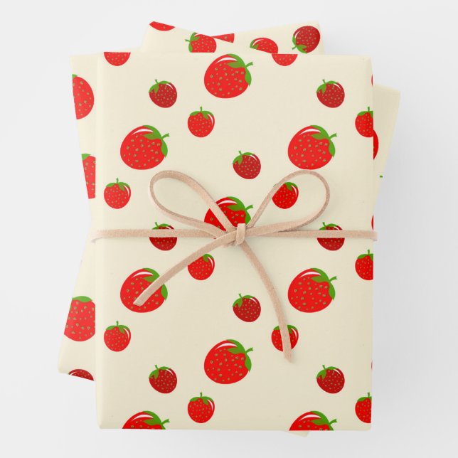 Red strawberry pattern on pale pink wrapping paper sheet (In situ)