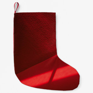 Red textile in close up photography small christmas stocking