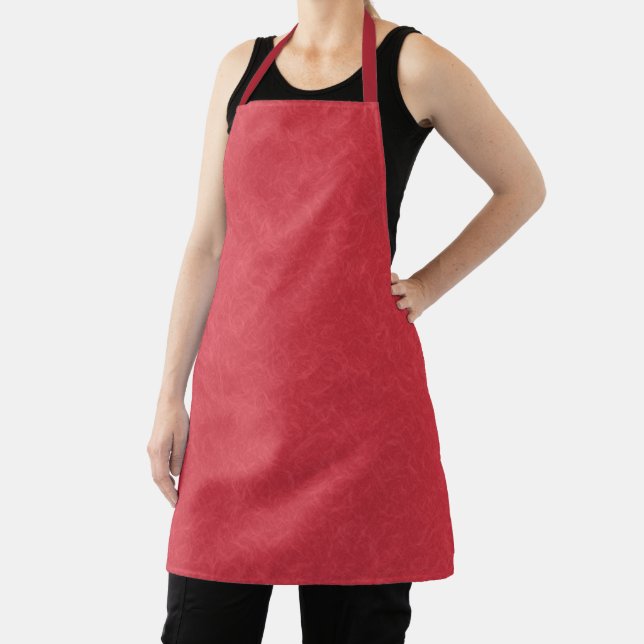 Red textured surface with subtle swirling pattern apron (Insitu)