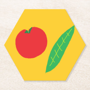 Red tomato and green leaf on orange paper coaster