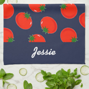 Red tomatoes on blue tea towel