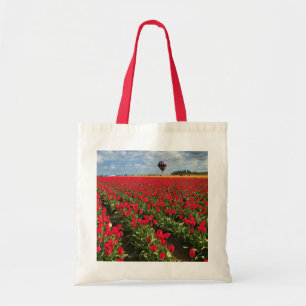 Red Tulip Field with Hot Air Balloon Tote Bag