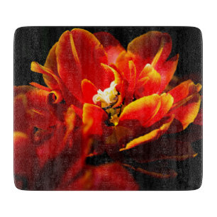 Red tulips dark background cutting board