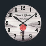 Red umbrella Love couple rustic romantic Wedding R Round Clock<br><div class="desc">Red umbrella watercolour painting. Love couple with red umbrella. Beautifully hand painted artwork by myself. Perfect for newlyweds,  couple.  Wedding anniversary gift. Valentine’s Day present. You can customise it with your names and date.</div>