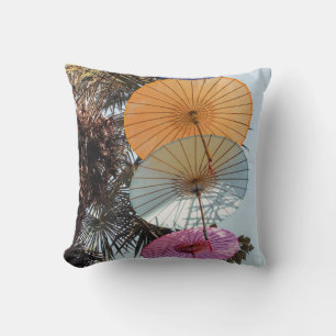 Red umbrella on green tree cushion
