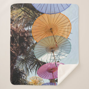 Red umbrella on green tree sherpa blanket