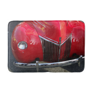Red Vintage 1930s auto on a floor mat