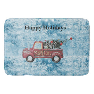 red vintage truck on a blue snowflake background  bath mat