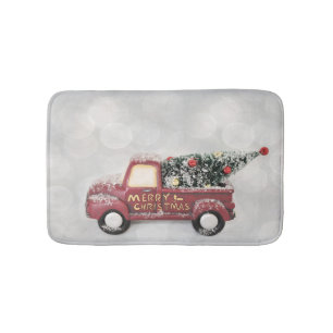 red vintage truck on a grey bokeh background bath mat