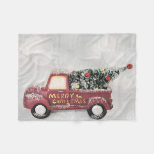 red vintage truck on a grey bokeh background fleece blanket