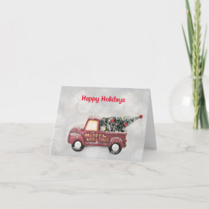 red vintage truck on a grey bokeh background holiday card
