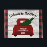 Red Vintage Truck with Christmas Tree Welcome Mat<br><div class="desc">Welcome your guests to your home this year with this festive personalised welcome mat featuring a vintage red pick up truck carrying a Christmas tree fresh from the farm. Easily personalise with your name or family name. Rustic wood, farmhouse style background and trendy red and black buffalo check. Part of...</div>