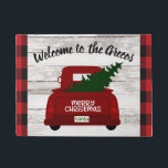 Red Vintage Truck with Christmas Tree Welcome Mat<br><div class="desc">Welcome your guests to your home this year with this festive personalised welcome mat featuring a vintage red pick up truck carrying a Christmas tree fresh from the farm. Easily personalise with your name or family name. Rustic wood, farmhouse style background and trendy red and black buffalo check. Part of...</div>