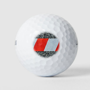 Red warning tape across granite stone golf balls