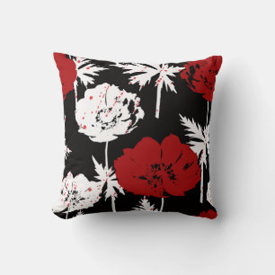 Red, white flowers on black . cushion
