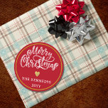 Red White Gold Merry Christmas Classic Round Sticker<br><div class="desc">Make this holiday season extra special with our Red White Gold Merry Christmas stickers. Whether you're embellishing your homemade gifts or sprucing up your holiday cards, these stickers are the perfect finishing touch. The sophisticated colour palette of black, white, and gold adds a touch of luxury to your Christmas festivities....</div>