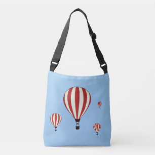 Red & white hot air balloons on sky blue crossbody bag