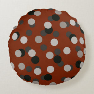 red with grey white and black dots round cushion