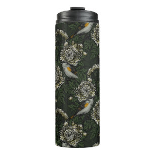 Redstarts in the chrysanthemums in green and white thermal tumbler