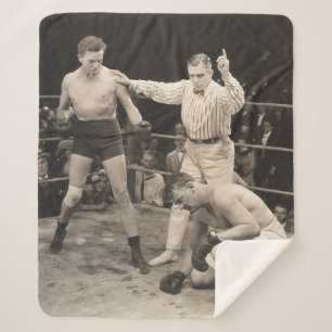 Referee counting over boxer in ringboxing, vintage sherpa blanket