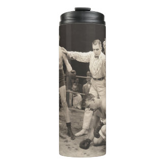 Referee counting over boxer in ringboxing, vintage thermal tumbler