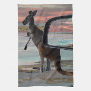 "Reflections of the Wild: A Kangaroo on the Beach Tea Towel