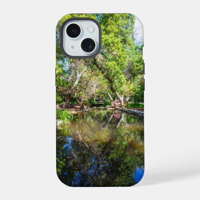 reflections on the pond in the garden iPhone 15 case (Back)