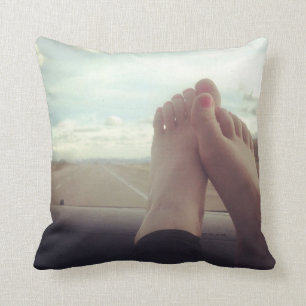 relax feet on the dashboard cushion