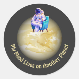 Relaxed Astronaut Sitting on Planet Classic Round Sticker