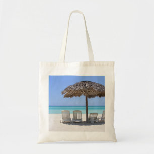 Relaxing at the beach tote bag