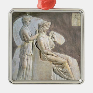 Relief depicting a woman at her toile metal ornament