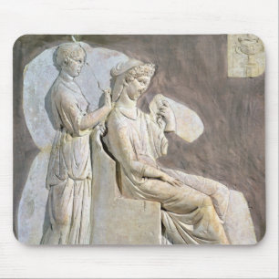 Relief depicting a woman at her toile mouse pad