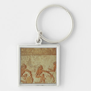 Relief depicting the making and baking of bread key ring