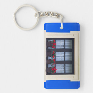 Residential housing with flowers in windows key ring