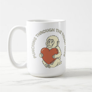 Resilient Baby Monkey & Heart Punching Through Coffee Mug