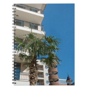 Resort bulding and palm tree notebook