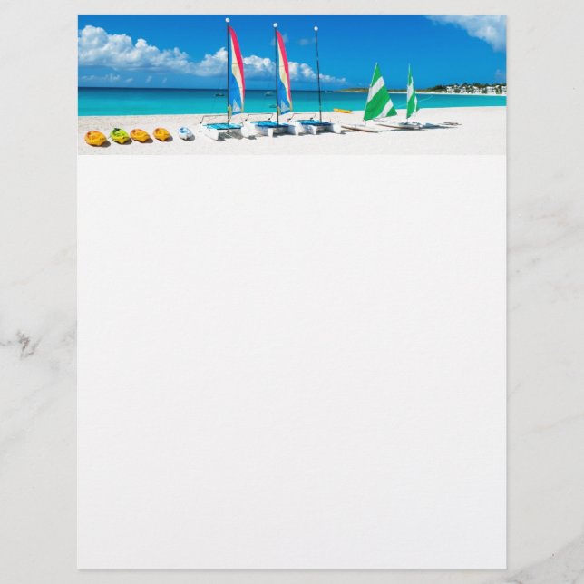 Resort's beach with boats on it (Front)