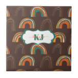 Retro 1970s Rainbow Pattern | Monogram Tile<br><div class="desc">In the 1970s colors came back down to earth - solid earthy colors to ground us. Design features an allover pattern of quirky rainbows in retro colors with rich chocolate background, with your name or choice of personalization. Add your custom wording to this design by using the "Edit this design...</div>