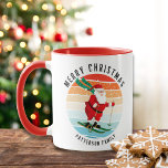 Retro Christmas Sunset Skiing Santa Personalised Mug<br><div class="desc">Retro Christmas Sunset Skiing Santa Personalised Mugs features an illustration of a retro Santa Claus skiing down a hill at sunset with the text "Merry Christmas" in modern typography and personalised with your family name. Personalise by editing the text in the text boxes provided. Designed by ©Evco Holidays www.zazzle.com/store/evcoholidays</div>