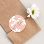 Retro Daisy Groovy Girl Birthday Party Classic Round Sticker<br><div class="desc">A fun, 70's style sticker to match our Retro Daisy Groovy Girl Birthday Party collection. This design features the birthday girl's name in big, groovy font typography with her age below in modern handwriting. There are white hippie daisy flowers over a blush-pink background. It can be used for favour bags,...</div>