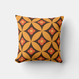 Retro flower on mid century orange circles cushion