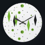 Retro Green Diamonds & Starbursts Wall Clock<br><div class="desc">This customisable Retro Green Diamonds and Starbursts Round Wall Clock is a new take on a vintage style. It features kitschy, black starbursts on green polka dots, surrounding geometric, green and black diamond shapes. Customise the background colour on this mid century modern product if you're feeling daring, or leave it...</div>