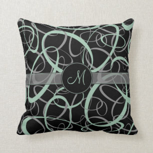 retro greyed jade and grey rings on black monogram cushion