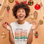 Retro mummy believes Santa Claus Christmas family T-Shirt<br><div class="desc">With its retro font style and vibrant colours,  this Christmas t-shirts bring a jolly vintage vibe to your festivities. The wording reads "Mummy believes in Santa Claus"</div>