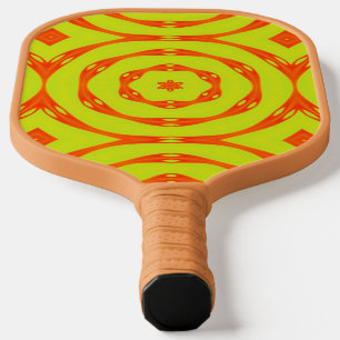 Retro orange circle on yellow pickleball paddle
